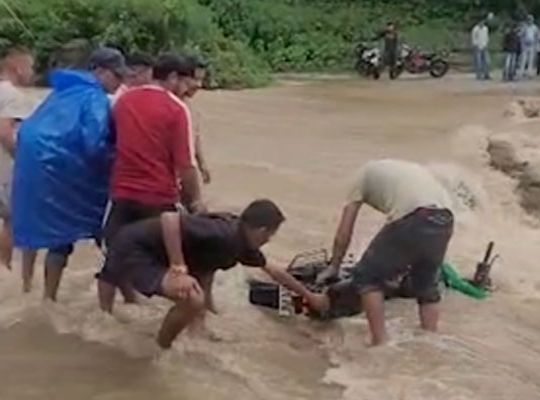 Torrential Monsoon in Uttarakhand: Rivers and streams in spate in Bageshwar; bike swept away by overflowing causeway, rider narrowly escapes.