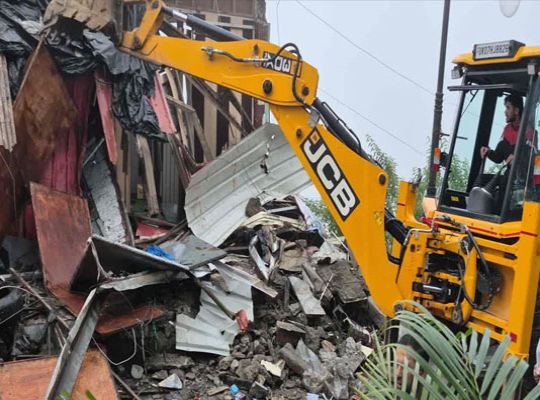 Administration's 'Yellow Claw' strikes in Mussoorie: 4 illegal shops near Jhulaghar razed; stir ensues.